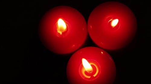 Three Burning Christmas Candles