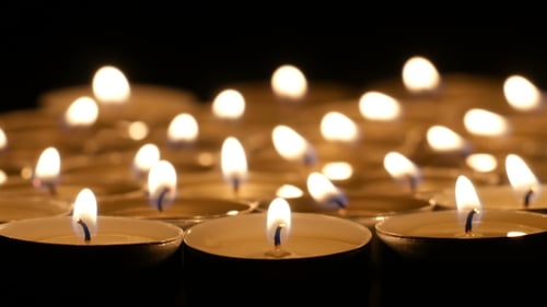 Glowing Candles Flicker in the Dark