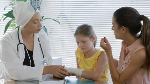 Medical Exam of Child's Bandaged Wrist