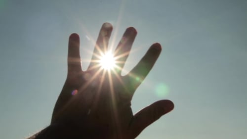 Sun Breaks Through The Fingers