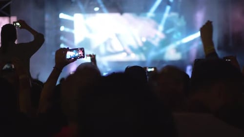 Rock Band Performing in Front of Hundreds Music Fans