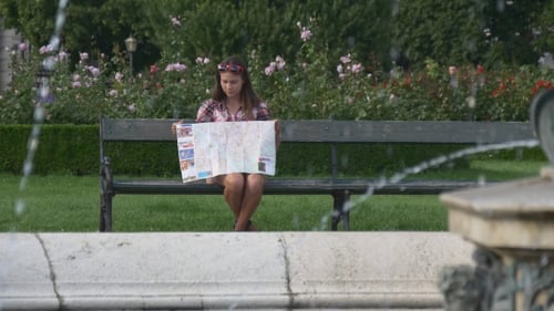 Girl Looking at Map on Park Bench