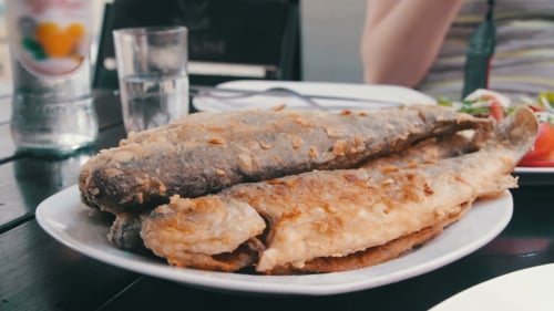 Seafood Cooked Fried Fish Trout On a Plate In a Restaurant
