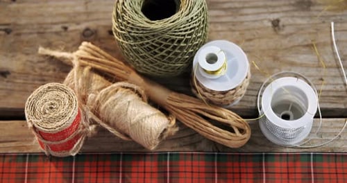 Festive Christmas Wrapping Items on Wooden Surface