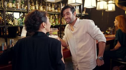 4K Group of People enjoy hangout nightlife at luxury bar.