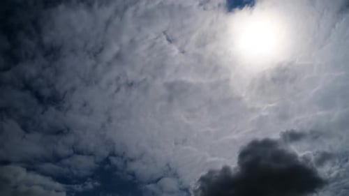 Dramatic Time-Lapse of Gray Clouds and Sunlight