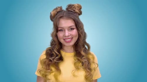 Smiling Young Woman with Curly Hair on Chroma Key