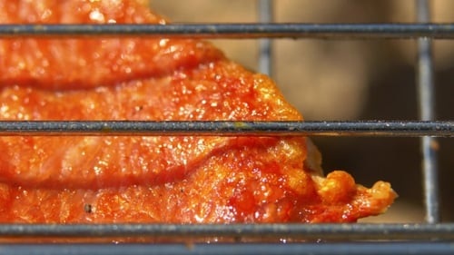 Part Of Juicy Pork Steaks Over Coals, Grilled, On The Brazier,