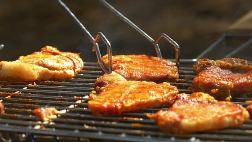 Grilled Pork Steaks Over Flames And Coals