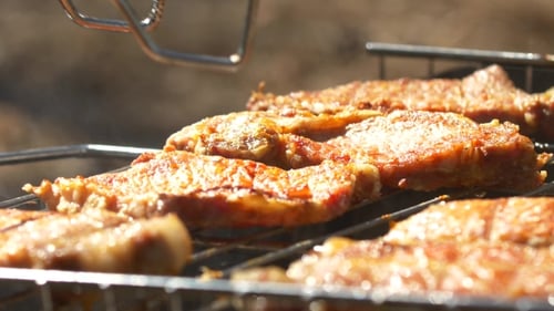 Grilled Steaks Over Flames And Coals