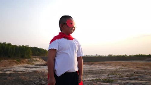 superhero boy running on the field