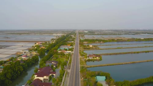 Aerial top view of natural sea salt ponds. Farm field outdoor. Material in traditional industry