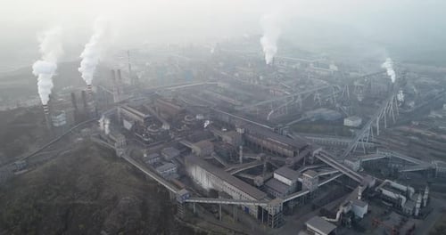 Aerial View of Big Factory in China. Air Pollution By Smoke Coming Out of Chimneys.