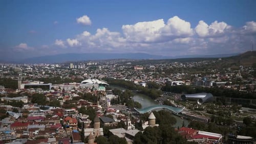 Tbilisi, Georgia. Top View Of Famous Landmarks In Summer Evening. Georgian Capital Skyline Cityscape