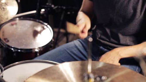 Male Musician Playing Drums And Cymbals At Studio 12