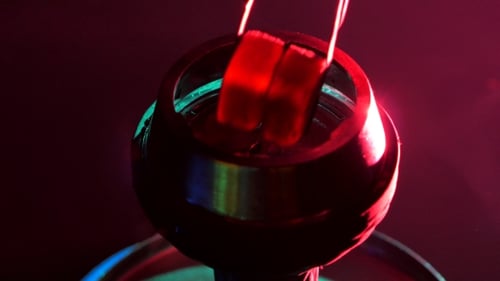 Hookah Bowl being Loaded with Charcoal Pieces