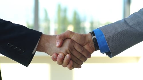 Two Businessmen Agreeing with a Handshake