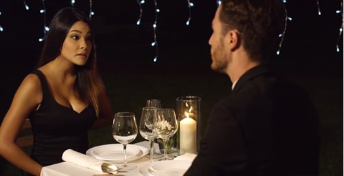 Romantic Couple at Dinner Under String Lights