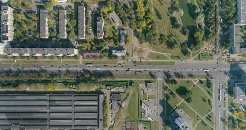 Aerial View of City Crossroad Industrial Area, Moving Cars Residential Buildings