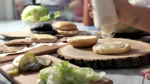 Preparing Gourmet Burger with Fresh Ingredients at Home