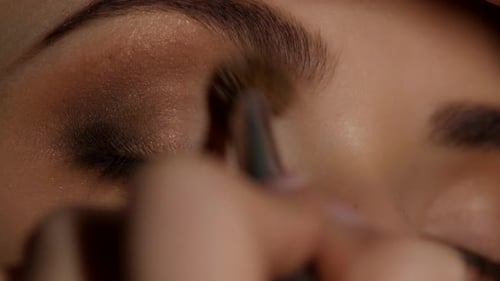 Applying Brown Eye Shadow Close Up Shot
