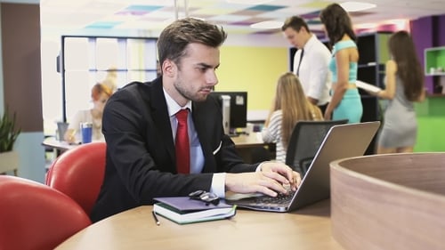 Man Hand Typing On Keypad Of His Laptop. Man Is Working In Office At Computer.