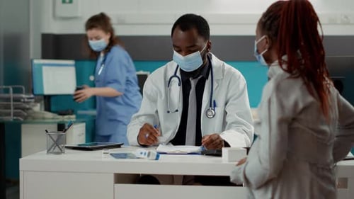 Doctor Consults with Patient in a Clinic