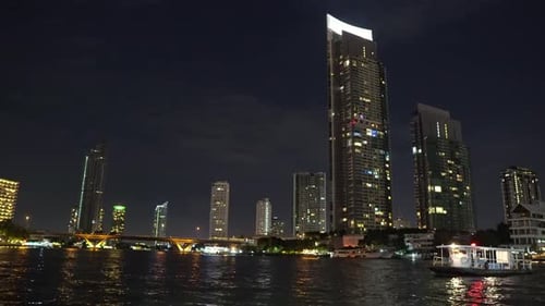 corporate buildings on the river bank with offices in bangkok