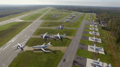 Aerial view of small airport with planes in the forest