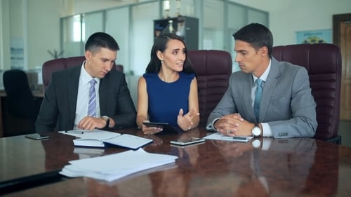 Business Team Having a Discussion at Conference Table