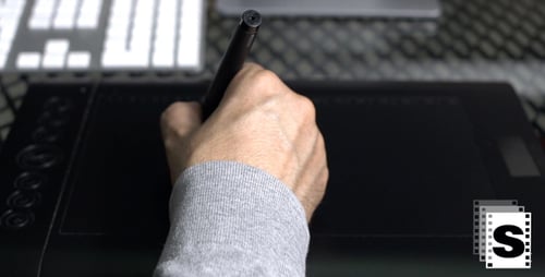 Hand Using Pen on Digital Tablet Close Up