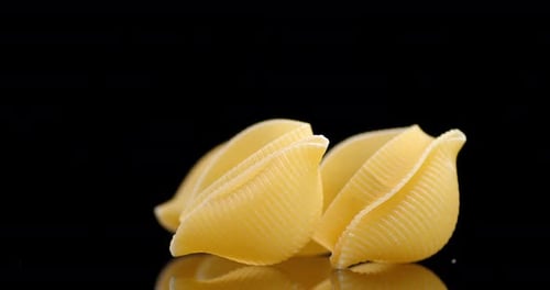 Close up of Conchiglie Pasta on Black Surface