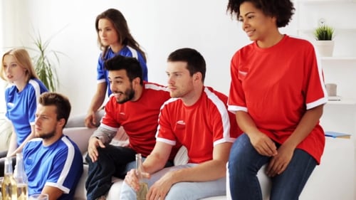 Enthusiastic Friends Watching Sports Together at Home