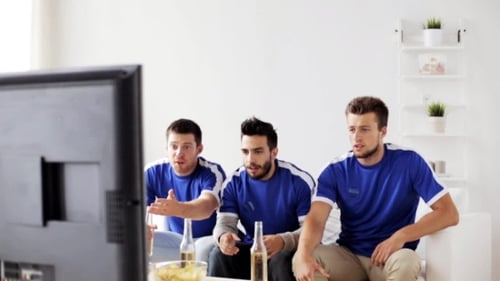 Friends Cheering and Celebrating While Watching Sports