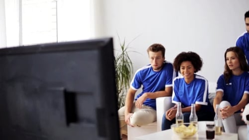 Excited Friends Watch Soccer at Home