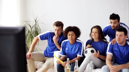 Friends Or Football Fans Watching Soccer At Home