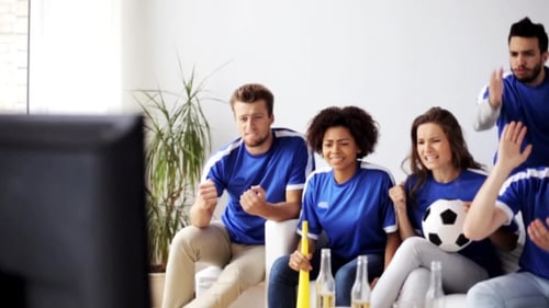 Friends Or Football Fans Watching Soccer At Home