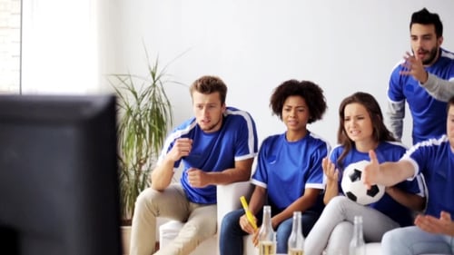 Friends Or Football Fans Watching Soccer At Home