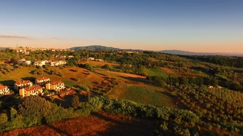 Scenic Aerial View of Rolling Hills at Sunrise