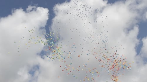 Colorful Balloons Floating Skyward on a Clear Day
