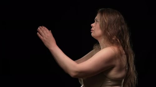 Side View Sad Obese Woman in Underwear Looking at Camera Turning Away Clasping Hands Praying