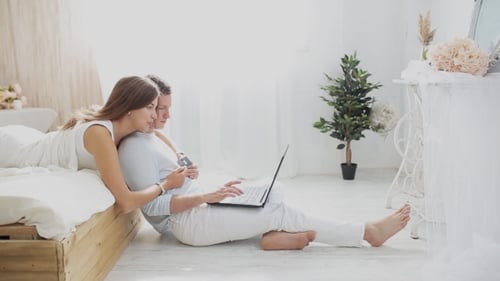 Couple Shopping Online with Credit Card at Home