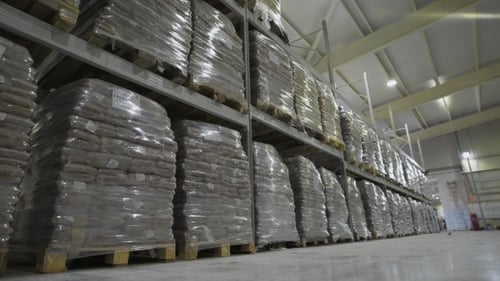 Large Furniture Warehouse. Mezzanine Shelving With Large Packages Of Food