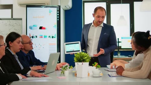 Business Team Meeting Data on Tablet