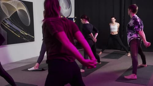 Yoga Class with Adults Doing Poses