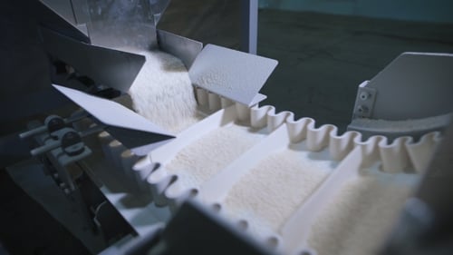 Factory For Packing Of Cereals And Other Food Products. There Packing Rice.