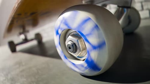 Spinning Skateboard Wheel Close Up Shot