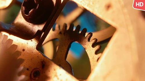 Intricate Clock Gears Turning Close Up