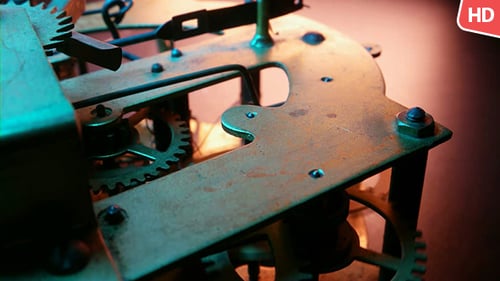Clockwork Gears Turning Inside of an Antique Clock