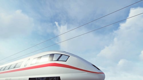 Sleek High-Speed Train Passing Under Clear Blue Sky